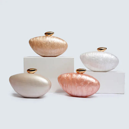 Sophisticated evening purse in sleek acrylic design, featuring a delicate chain for an upscale look.