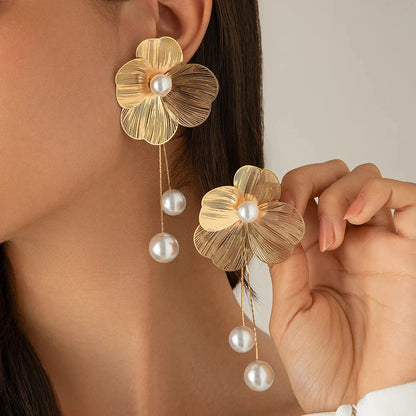 Luxury romantic long tassel drop earrings featuring delicate flower petals and shimmering imitation pearls, perfect for elegant women.