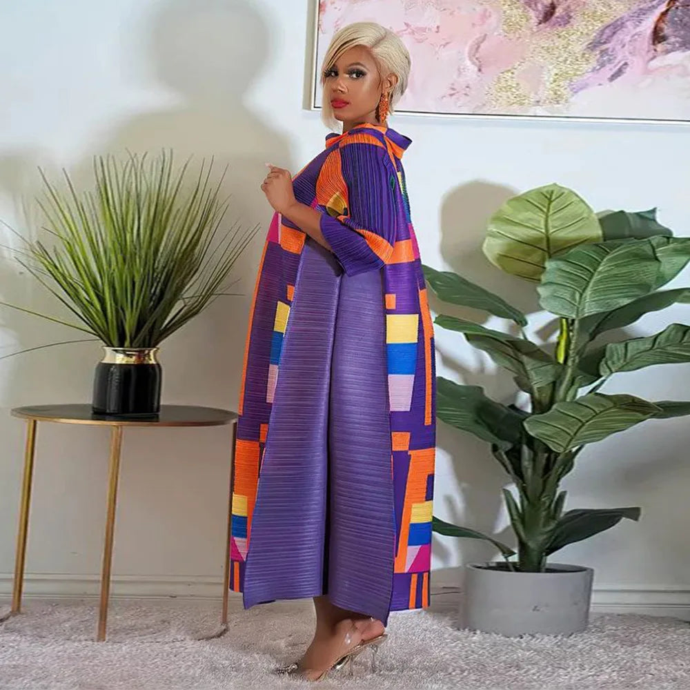 Elegant African plus size O-neck pleated long dress in vibrant traditional Dashiki style for women featuring 3/4 sleeves.