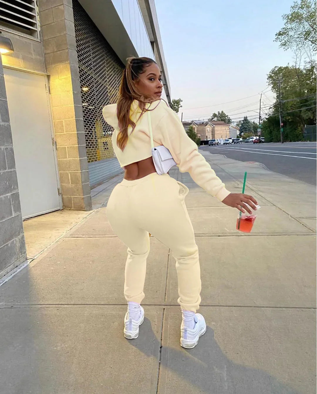 Elegant long sleeve pink cropped hoodie from the luxury running set, designed for comfort and style during workouts.