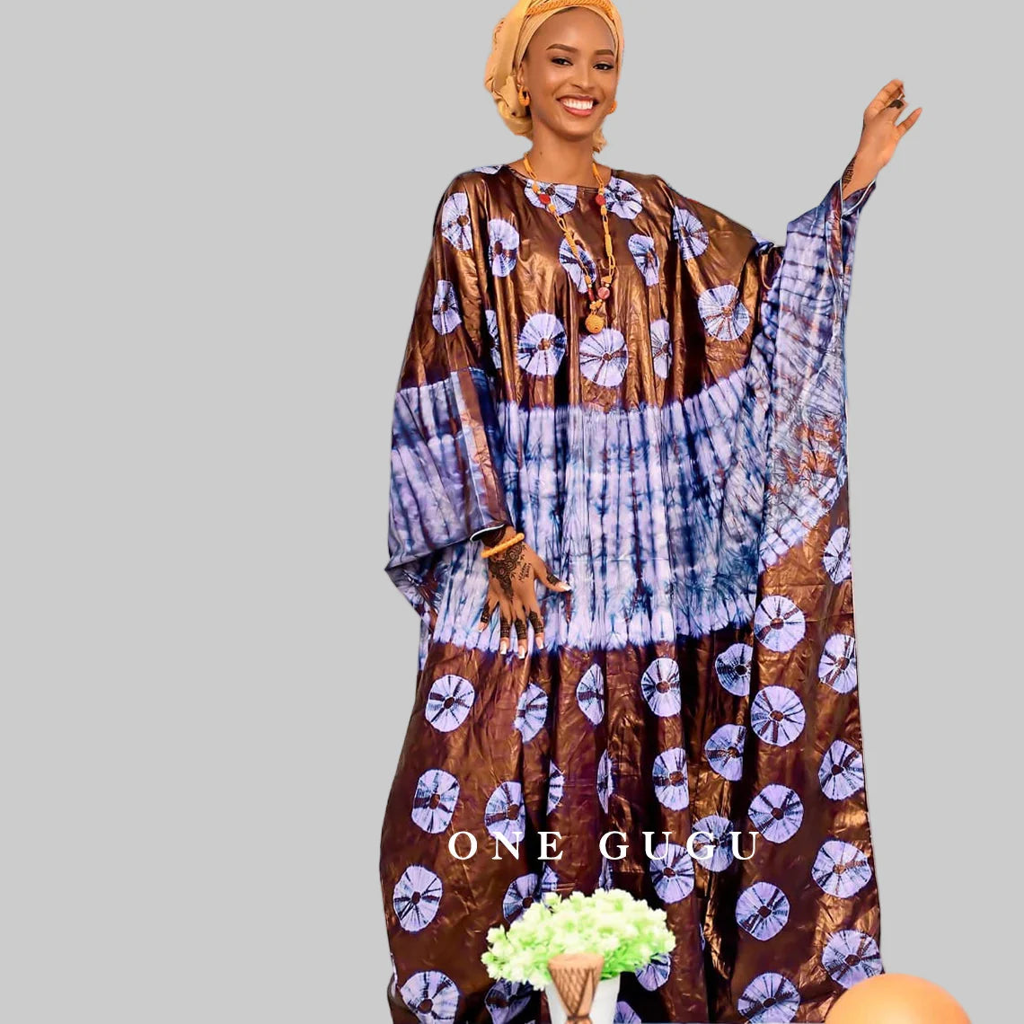 Chic and luxurious cotton dress with unique Dashiki print and lace embellishments, perfect for fashionable women.