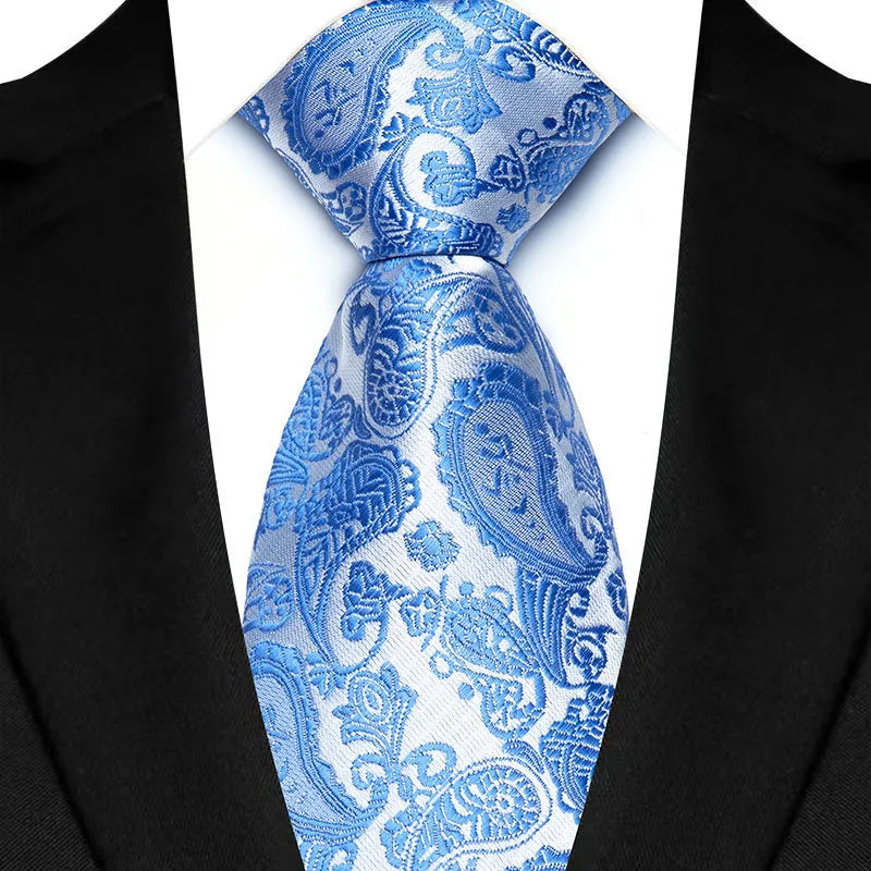 Luxurious woven floral jacquard tie with vibrant green and blue tones, perfect for modern gentlemen.