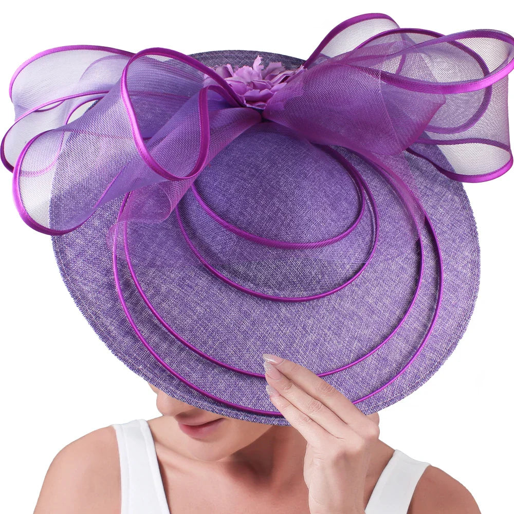 Fashionable large fascinator hat elegantly worn at a garden party, highlighting its exquisite craftsmanship and style.