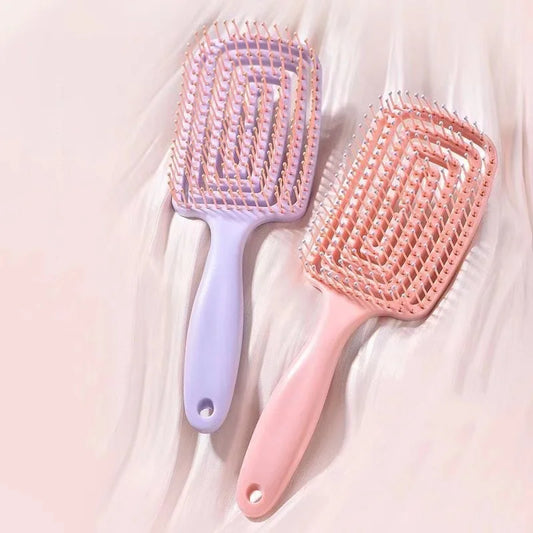 Elegant plastic massage comb featuring a unique hollow design, ideal for luxurious hair care and soothing scalp treatments.