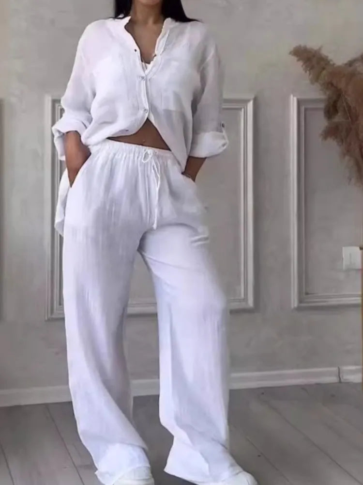 Elegant women's casual two piece set featuring a long sleeve pocket shirt paired with loose wide leg pants, ideal for spring and autumn fashion.