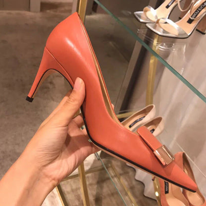 Close-up of sequined cloth upper on luxury high heels with thin stiletto heels, showcasing exquisite craftsmanship for the modern woman.