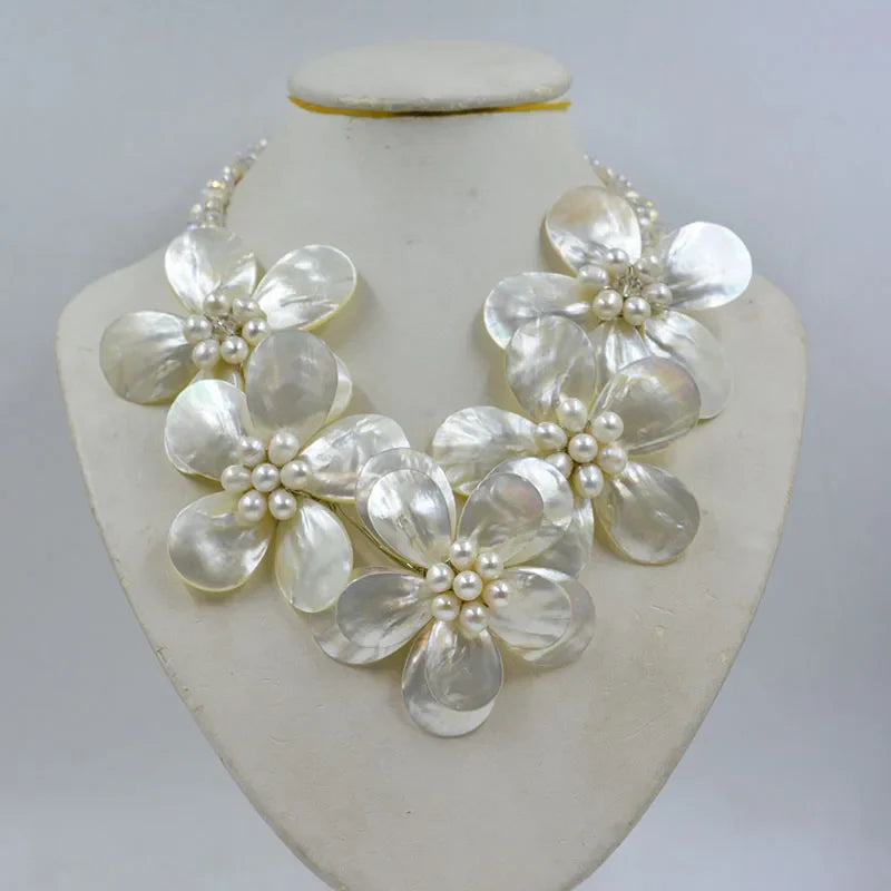 Stylish women's jewelry set featuring a shell flower necklace and elegant earrings, embellished with crystals for a luxurious wedding accessory.