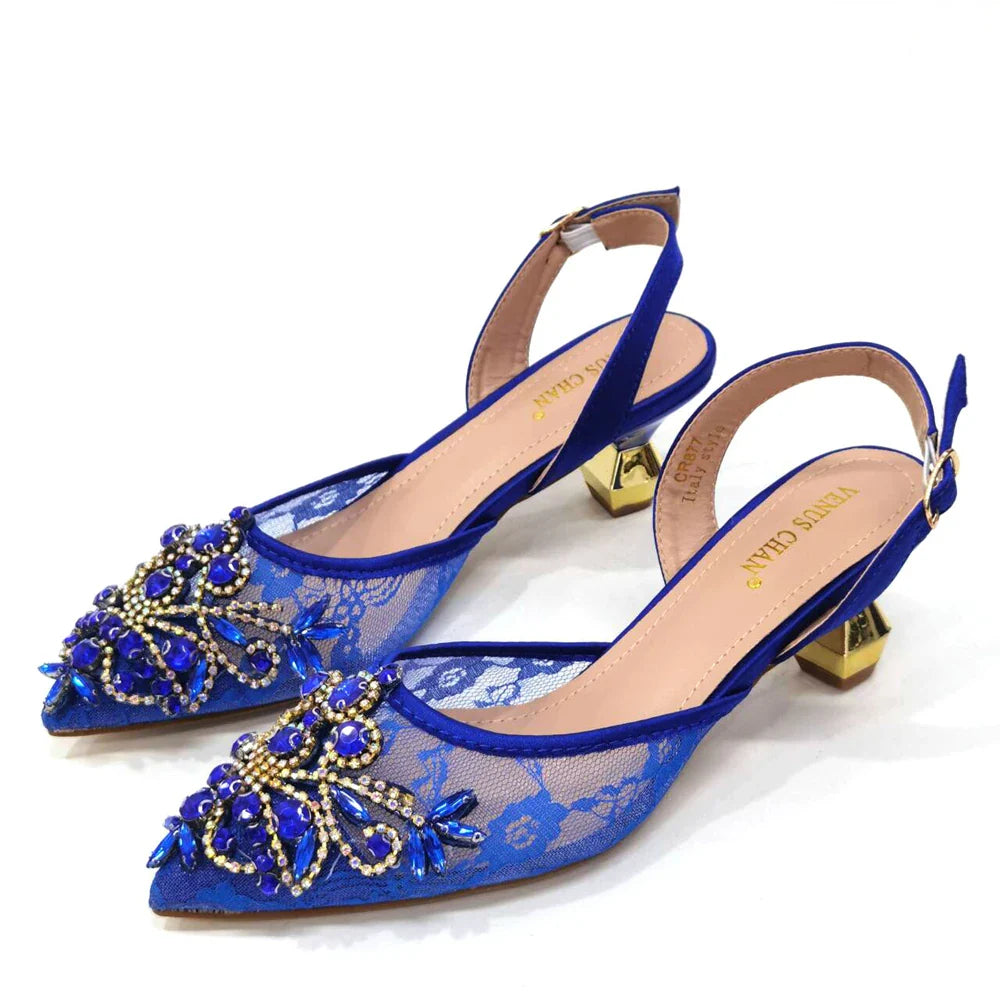 Sophisticated close-up of pointed toe design with delicate butterfly-knot on stylish green lace low heel shoes.