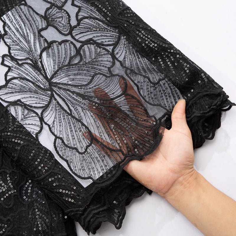 Elegant African Milk Silk lace with intricate embroidery and sequins, showcasing 51-52 inches of luxury fabric suitable for opulent Nigerian wedding dresses.