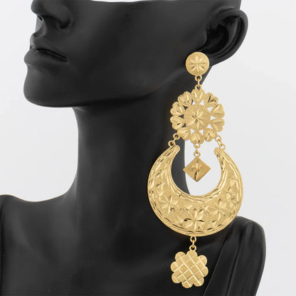 Chic pair of 18K gold plated earrings with large copper tassel, embodying a trendy geometric style suitable for special occasions and daily wear.