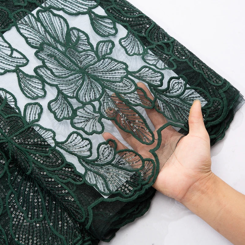 High-quality embroidered tulle showcasing elegant sequins, perfect for elaborate Nigerian wedding attire made from African Milk Silk.