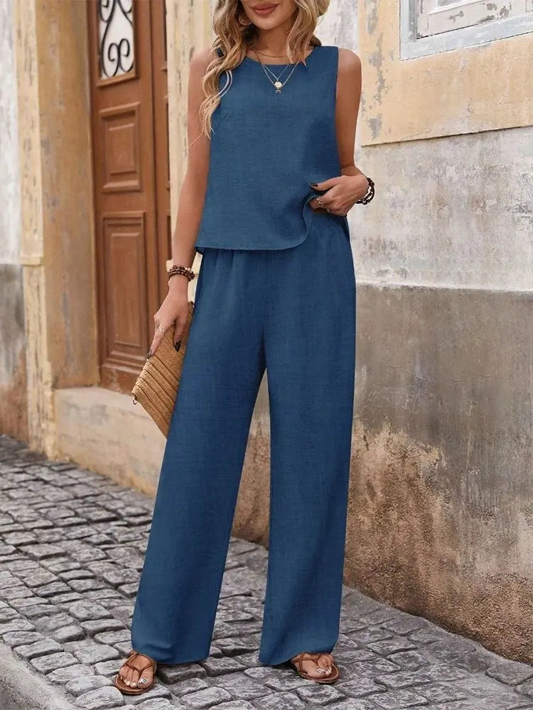 Stylish women's fashion set featuring a sleeveless top and flowy wide leg pants in breathable chiffon, ideal for summer events and casual elegance.