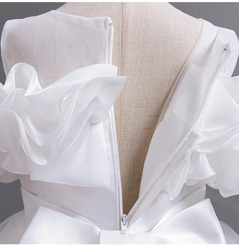 Charming ball gown silhouette of a girls' evening dress, designed for comfort and elegance, showcasing ankle-length styling and O-neck collar.