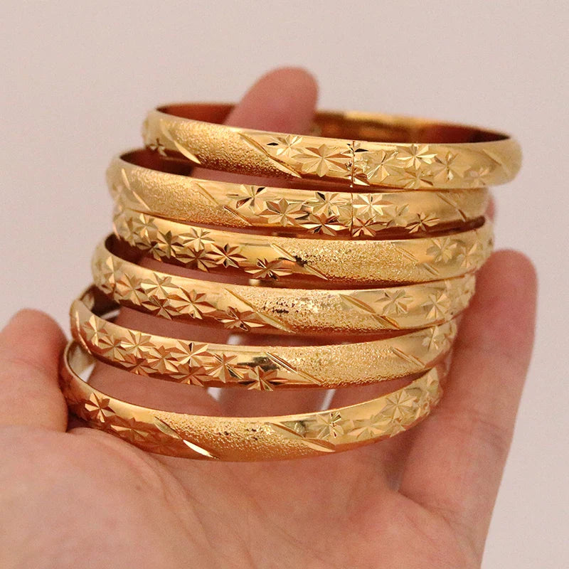 Elegant African-style gold bangles for both men and women, ideal bridal gift, featuring a chic design that enhances any outfit.