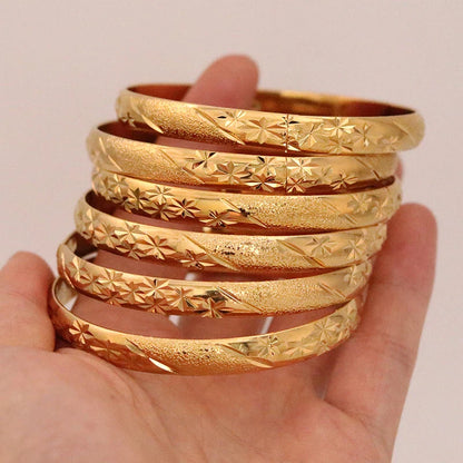 Elegant African-style gold bangles for both men and women, ideal bridal gift, featuring a chic design that enhances any outfit.