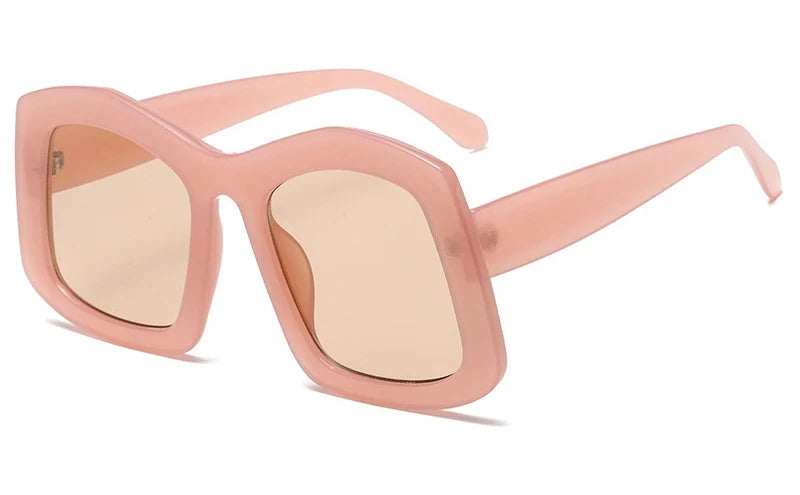 Close-up view of luxury oversized square sunglasses in gradient orange, showcasing their elegant design and high-quality craftsmanship, perfect for fashion-forward women.