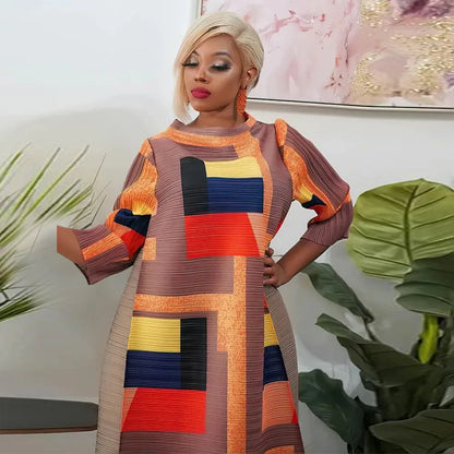 Chic African-inspired long dress with an elegant pleated design and stylish 3/4 sleeves, ideal for plus-size women seeking traditional yet modern attire.
