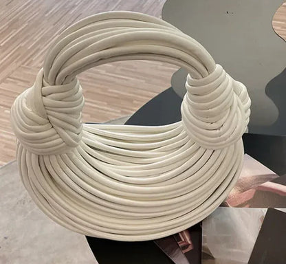 Chic gold hobo clutch handbag displaying a solid pattern, designed for the modern woman seeking a trendy accessory.