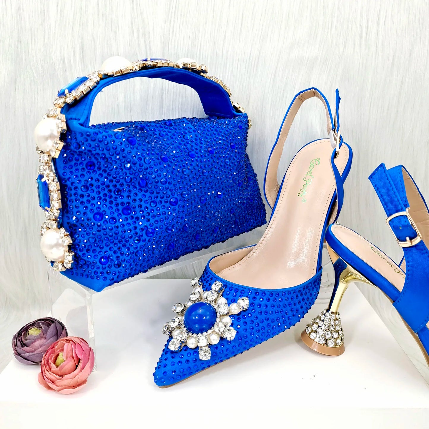 Chic blue women's stiletto heels paired with a stylish fashion bag set, designed for elegance and comfort, suitable for various occasions.