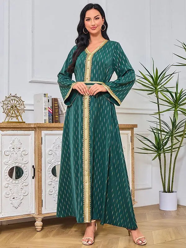 Luxurious golden velvet abaya with bat sleeves and sequins, perfect for Ramadan celebrations and elegant gatherings.