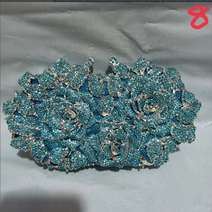 Luxury women's minaudière clutch evening purse crafted from metallic leather, featuring a sophisticated design adorned with sparkling crystal accents, perfect for glamorous occasions.