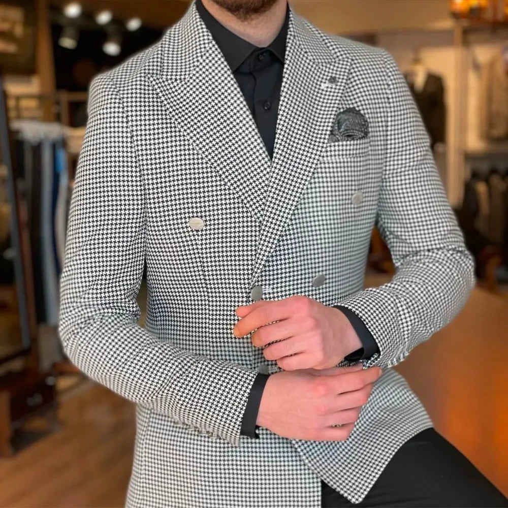 Close-up view of the intricate houndstooth pattern on a men's double-breasted jacket, showcasing luxury craftsmanship.
