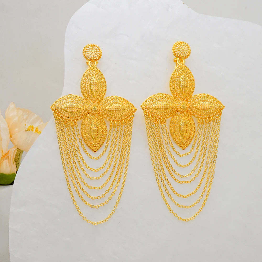 Stunning geometric African gold drop earrings showcased on a velvet background, highlighting their trendy bohemian style.