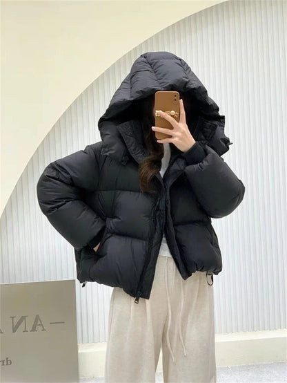 High-quality cotton and polyester blend hooded jacket for women, offering supreme comfort and styling versatility for the autumn and winter seasons.