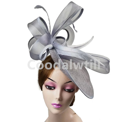 Elegant grey fascinator pillbox cap for women, perfect for weddings and formal events, featuring a sophisticated design and luxurious materials.