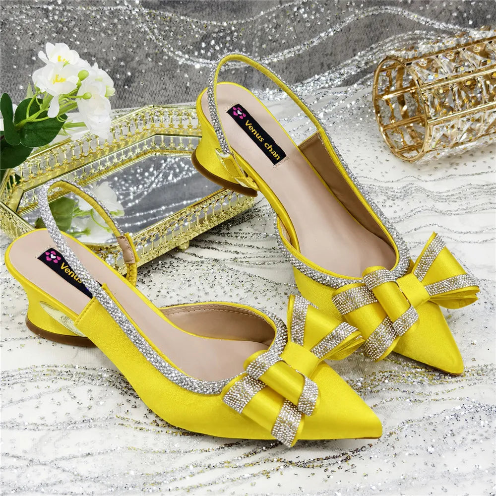 Artistic angle of elegant high-heels with a crystal chain, perfect for summer parties, exuding high fashion and femininity.