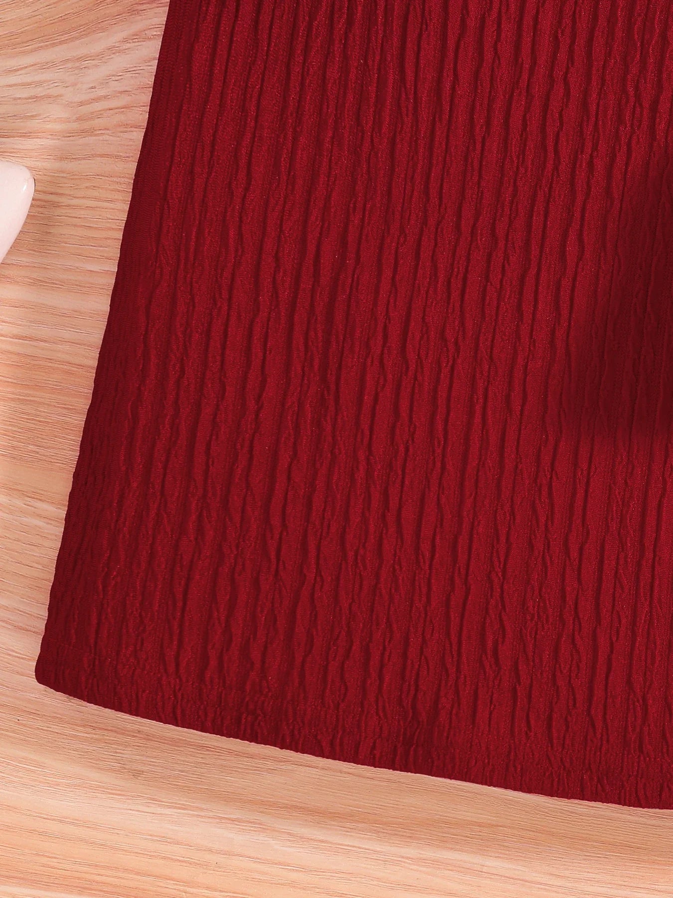 Girls' fashion in focus with a luxurious red O-neck knitted dress adorned with a decorative bow, designed for ages 7-13, suitable for autumn season.