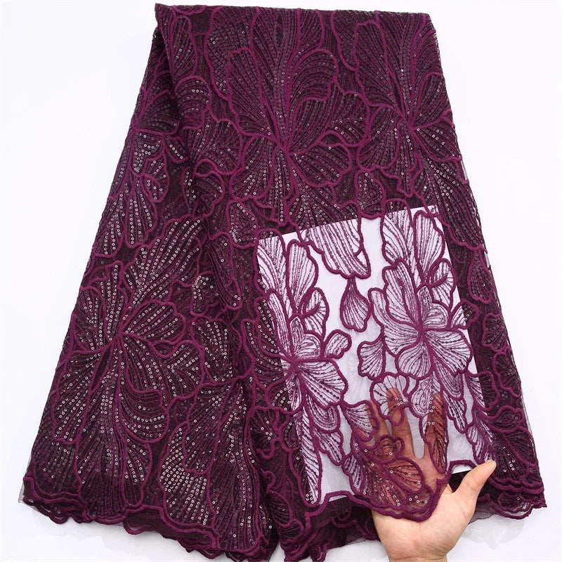 Sophisticated 51-52 inch African lace fabric with a lavish mesh texture and delicate sequined embellishments for high-end wedding attire.