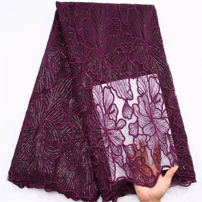 Sophisticated 51-52 inch African lace fabric with a lavish mesh texture and delicate sequined embellishments for high-end wedding attire.