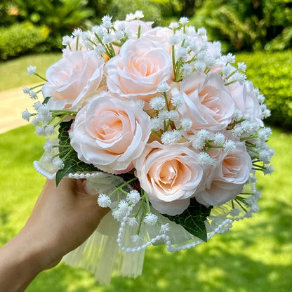 Lavish wedding bouquet made of silk, featuring charming babysbreath roses and adorned with exquisite pearl lace, an ultimate bridal accessory.