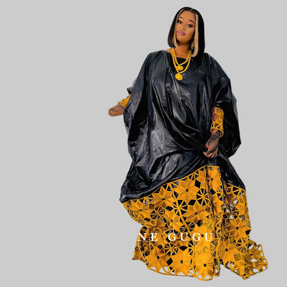 Elegant African Bazin gown featuring rich gold embroidery, designed for plus size women, showcasing a beautiful long sleeve dashiki style.