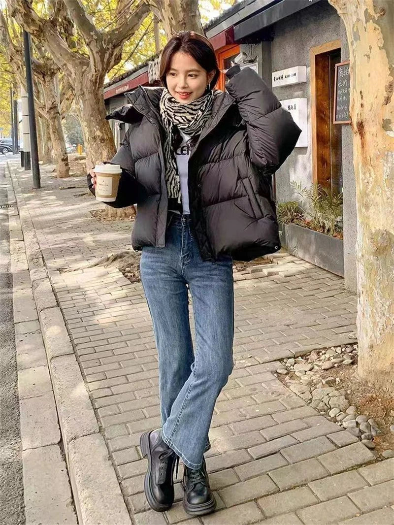 Sophisticated hooded winter coat for women, adorned with buttons and zippers, embodying a perfect blend of comfort and style.