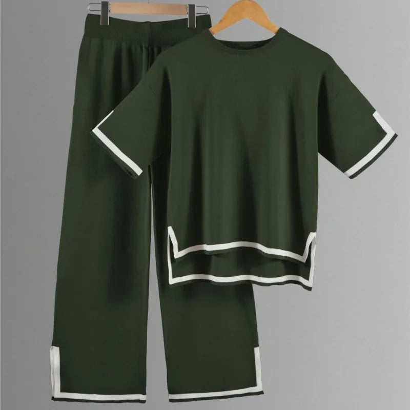 Close-up view of the luxurious polyester fabric used in the elegant women's knitted trousers suit, showcasing its soft texture and exquisite craftsmanship.