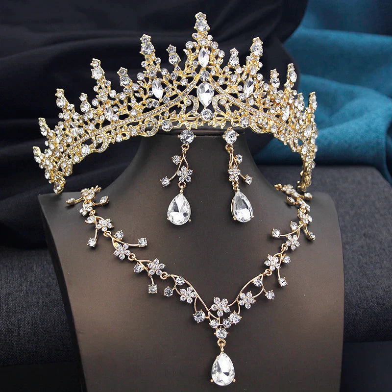 Elegant opal green tiara adorned with crystals, complemented by matching necklace and earrings for a stunning bridal look.