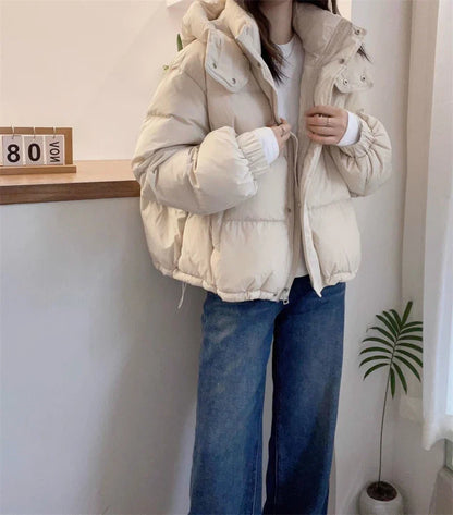 Luxurious women's slim fit hooded puffer jacket crafted from premium cotton and polyester blend, designed for warmth during autumn and winter.