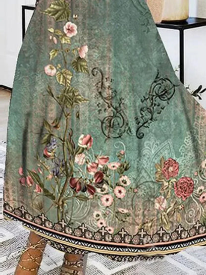 Elegant autumn floral maxi dress for women featuring a deep V-neck design and long sleeves, perfect for seasonal styling.