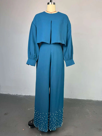 Elegant women's outfit set featuring an O-neck embroidered lantern sleeve top paired with sophisticated wide-leg trousers, perfect for chic party or casual occasions.