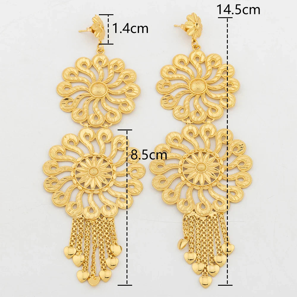 Stylish geometric drop earrings in 18K gold, adorned with an eye-catching copper tassel, ideal for enhancing any outfit.