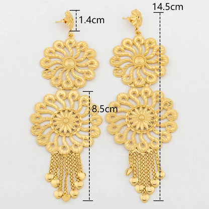 Stylish geometric drop earrings in 18K gold, adorned with an eye-catching copper tassel, ideal for enhancing any outfit.