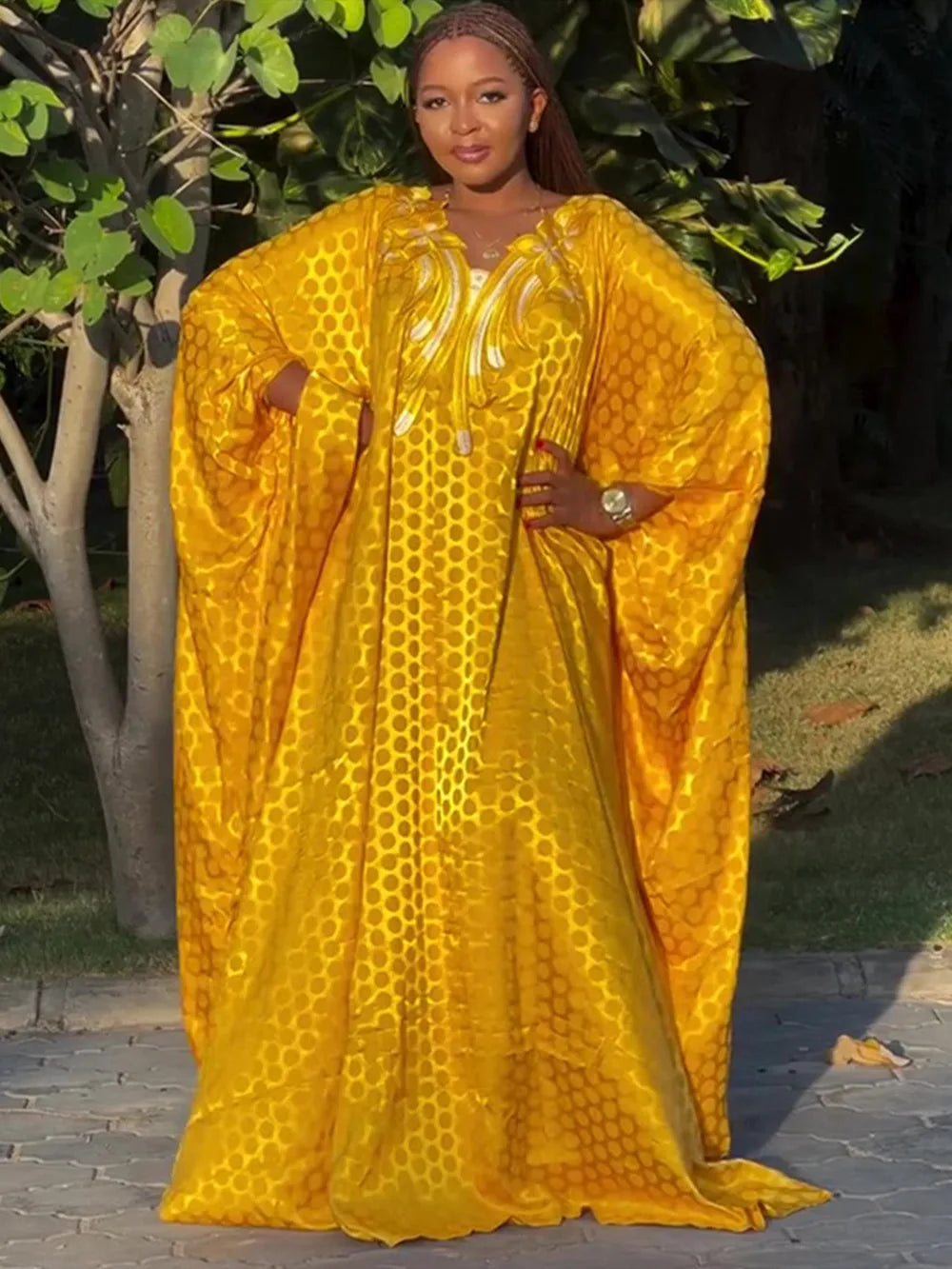 Luxury African Muslim Kaftan for Women featuring exquisite embroidery on rich satin fabric, ideal for elegant evening occasions.