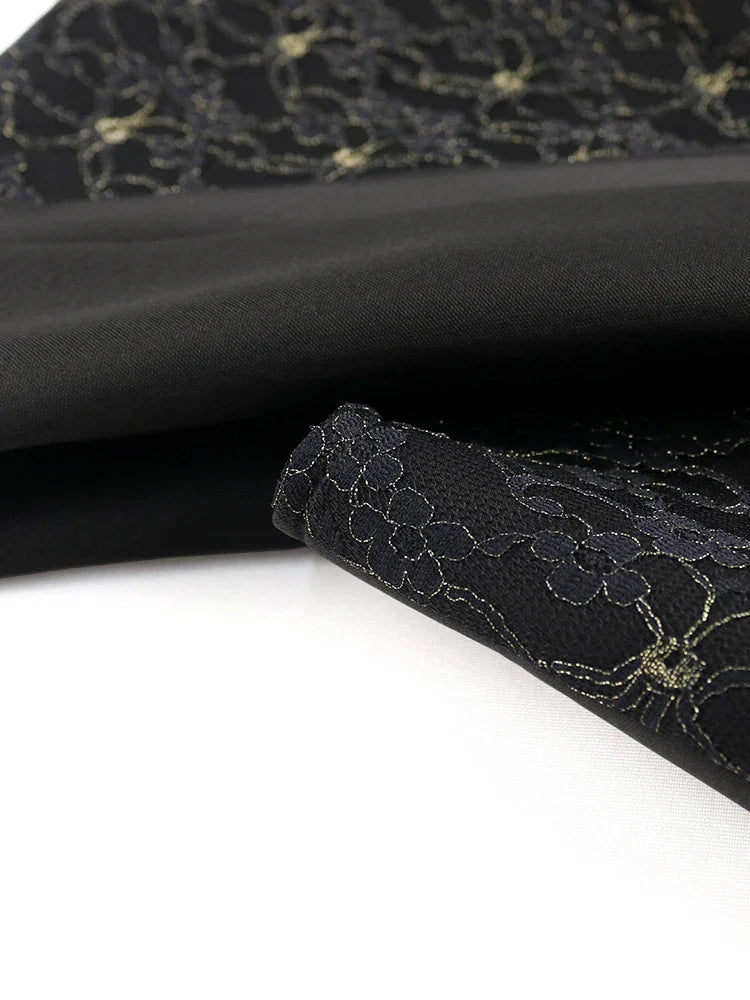 Close-up of intricate lace details on the luxurious black bodycon evening dress, highlighting its elegant craftsmanship and design.