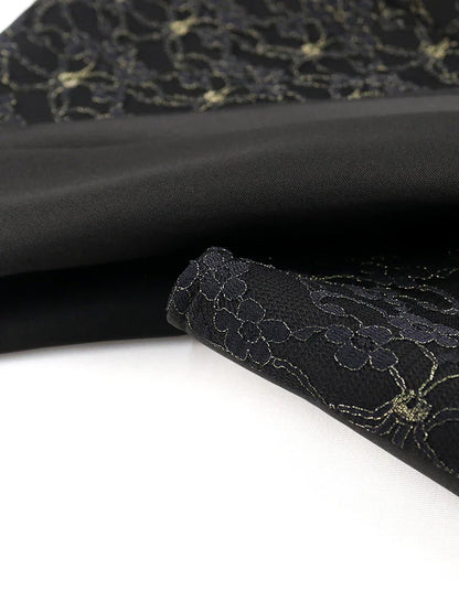 Close-up of intricate lace details on the luxurious black bodycon evening dress, highlighting its elegant craftsmanship and design.