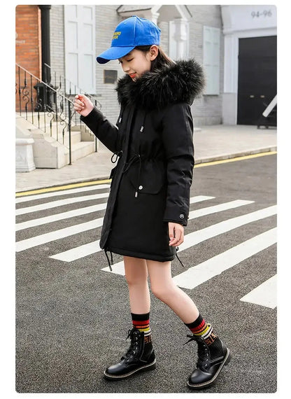 Chic hooded winter parka for girls, adorned with a plush fur collar, ideal for ages 5-14, combining functionality and fashionable design.