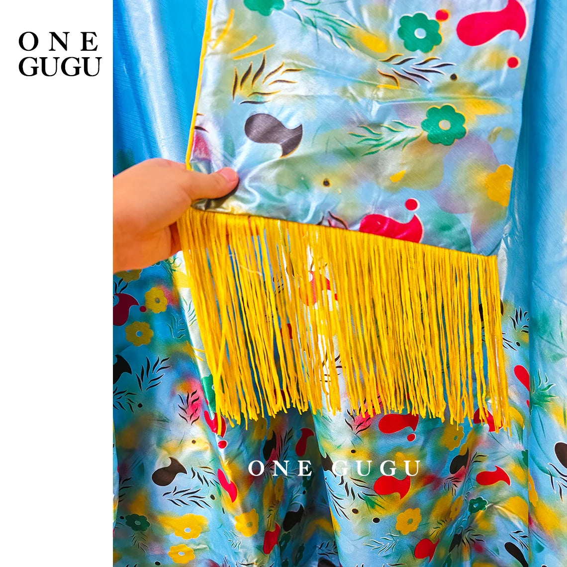 Full view of the stunning luxury African Dashiki wedding dress in blue, designed for women, elegantly styled with a graceful shawl.