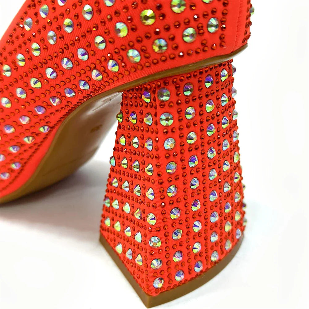 Fashionable display of women's yellow rhinestone shoes and handbag set by Venus Chan, crafted for comfort and style at parties.