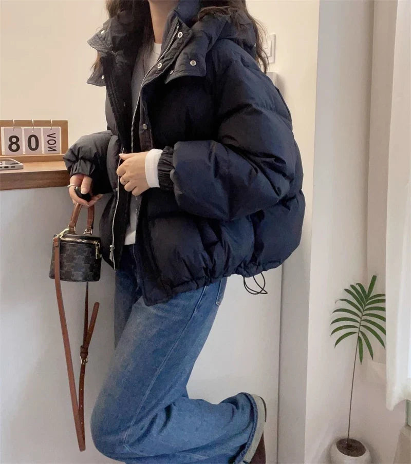 Luxurious cotton padded long sleeve parka exemplifying casual style with practical pockets and zipper closures, ideal for contemporary women's winter wardrobes.